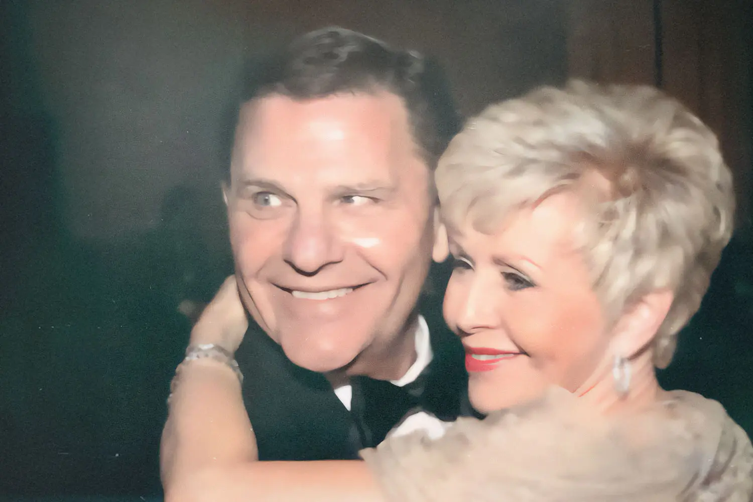 Gloria Copeland hugging Kenneth Copeland's neck