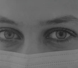 Close-up of person's face covered with a mask