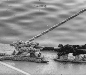 black and white photo boat tied off