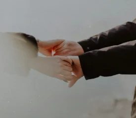 two people holding hands
