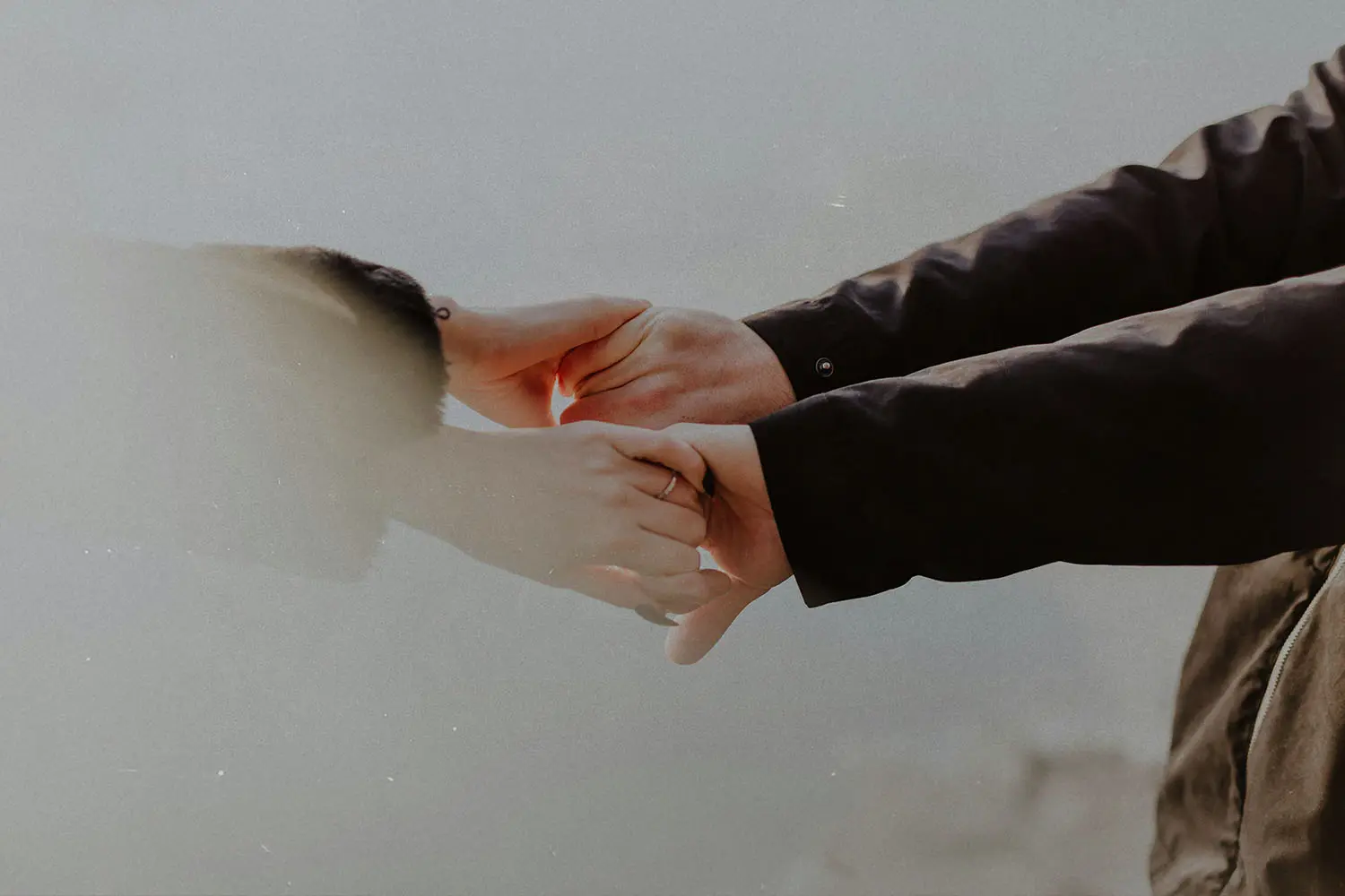 two people holding hands