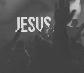LED screen that reads "JESUS" with hands lifted