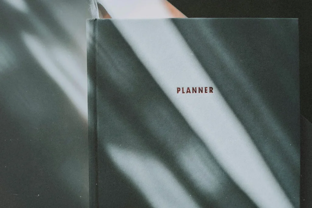 Cover of a monthly planner in low. moody light