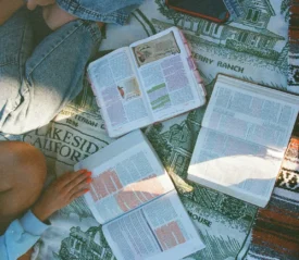 Group of people with 3 open bibles