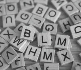 Pile of wooden tiles with Alphabet letters