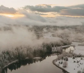 snowy river with fog