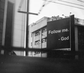 Sign that says "Follow Me. - God"