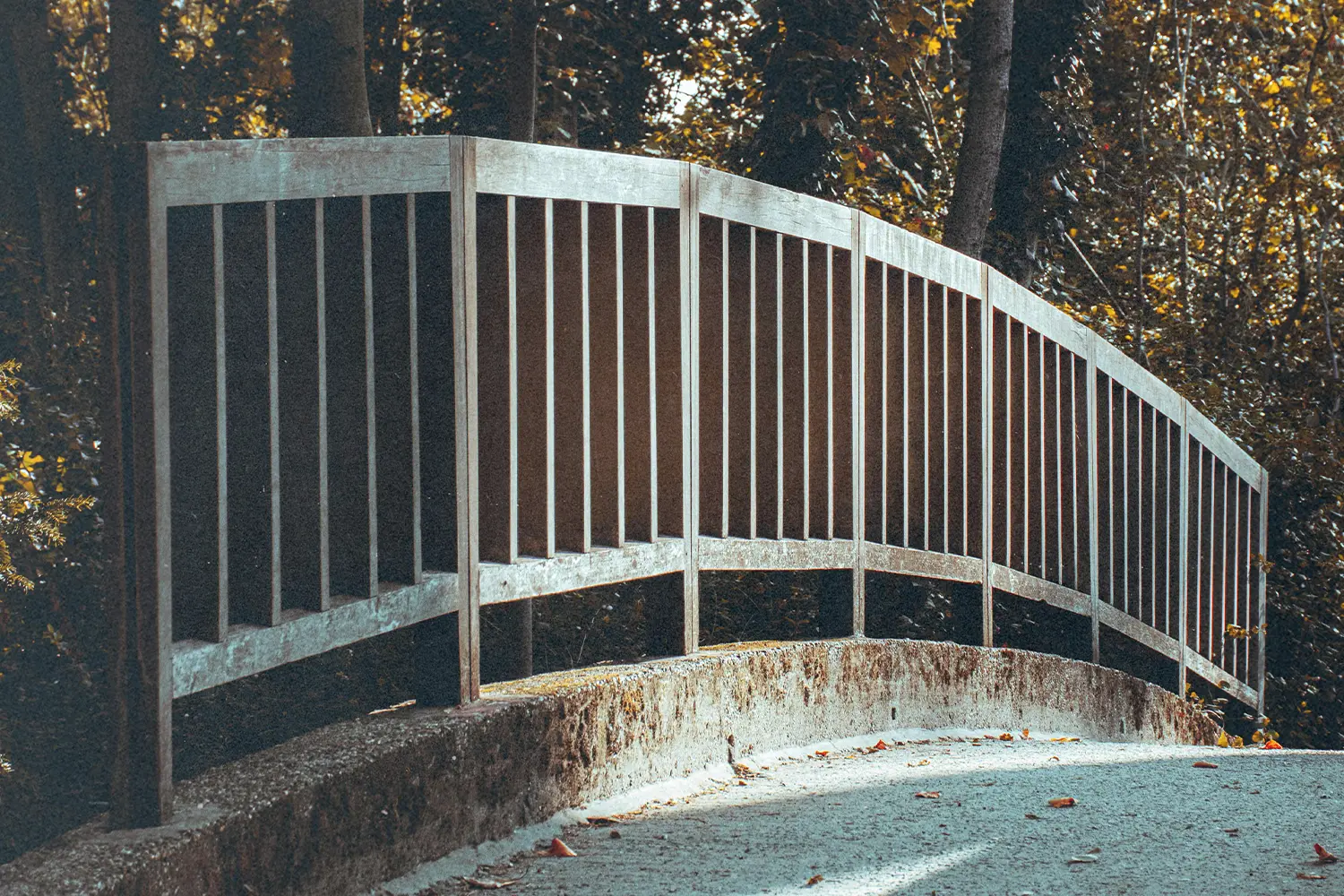 Metal railing with a concrete sidewalk