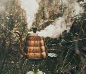 Copper kettle with steam coming out