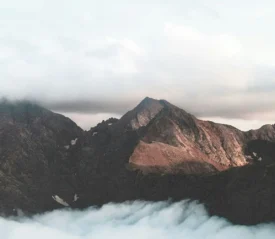 Clouds resting in the valley of mountains