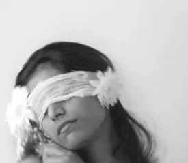 Woman with a cloth covering her eyes