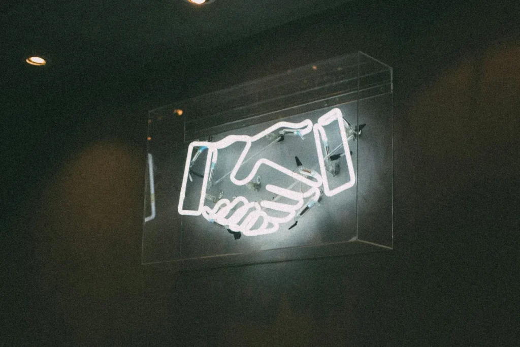 LED sign of a shaking hands icon