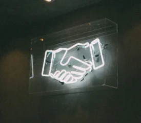LED sign of a shaking hands icon