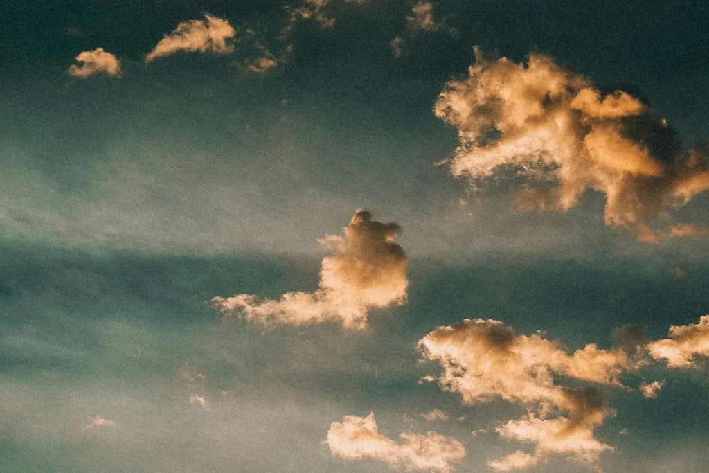 scattered clouds lit by sunlight