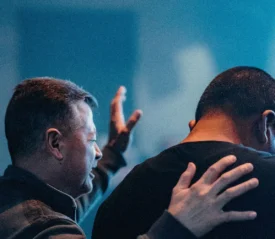 two men praying for healing
