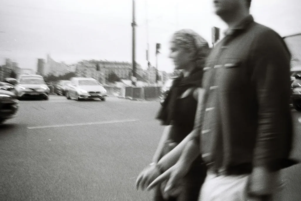 Blurred image of a couple holding hands walking
