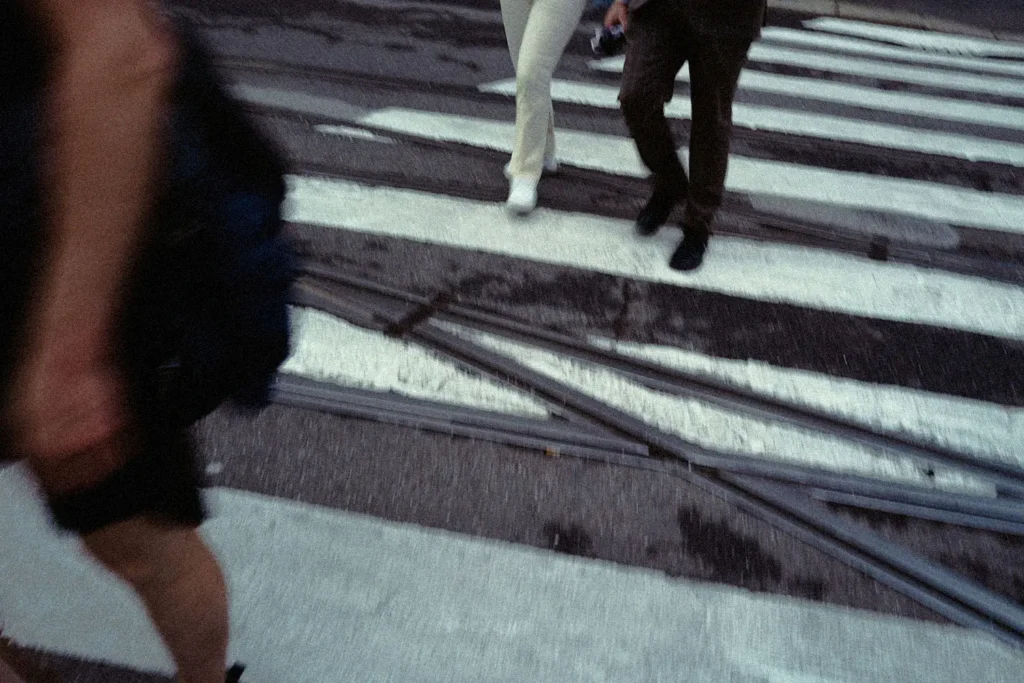 Leg shots of group of people walking on a crosswalk