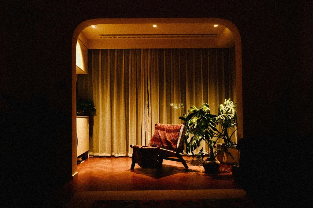 empty chair in a lit dimly room