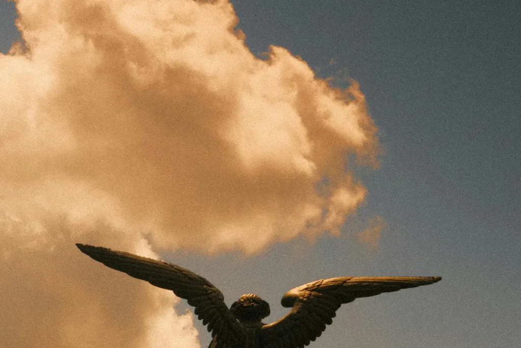 cloud behind an angel statue