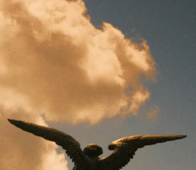 cloud behind an angel statue
