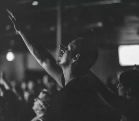 Man lifting hands in worship