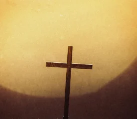 cross in front of the sun