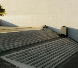 woman sitting outside on concrete steps