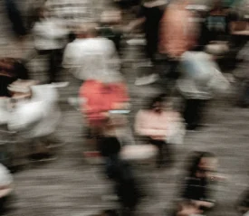 Blurred image of crowd of people walking