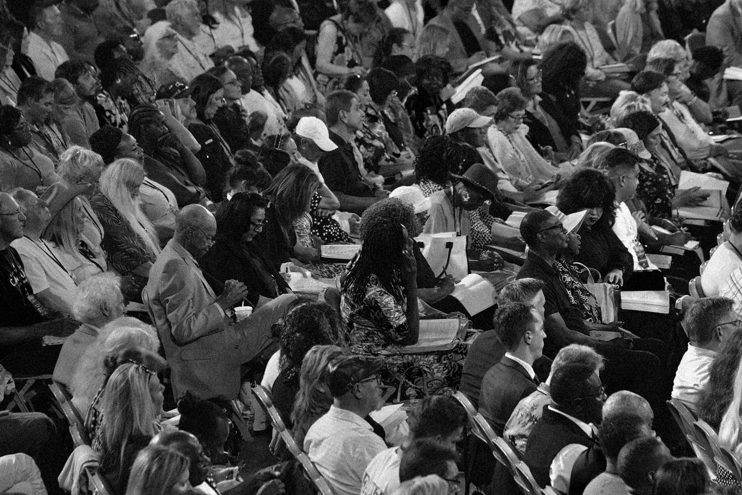 people at convention reading bibles