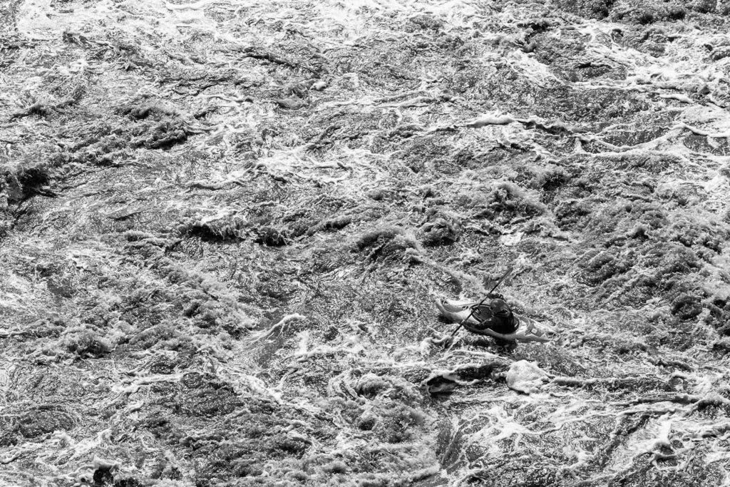 Kayak in the middle of rushing waters