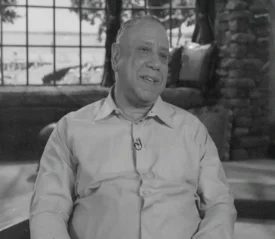 Robert Scales sitting in the Believer's Voice of Victory Broadcast studio