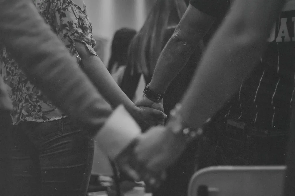 Line of people holding hands