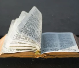 Open Bible with multiple pages turning