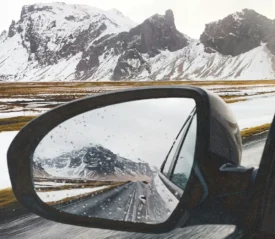 mountains in the side mirror of a car
