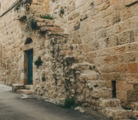 Limestone steps on the side of building