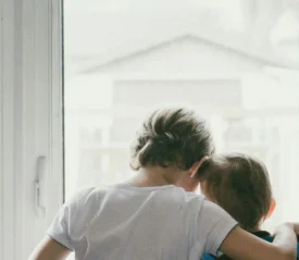 couple embracing in the doorway