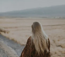 person walking a dirt path