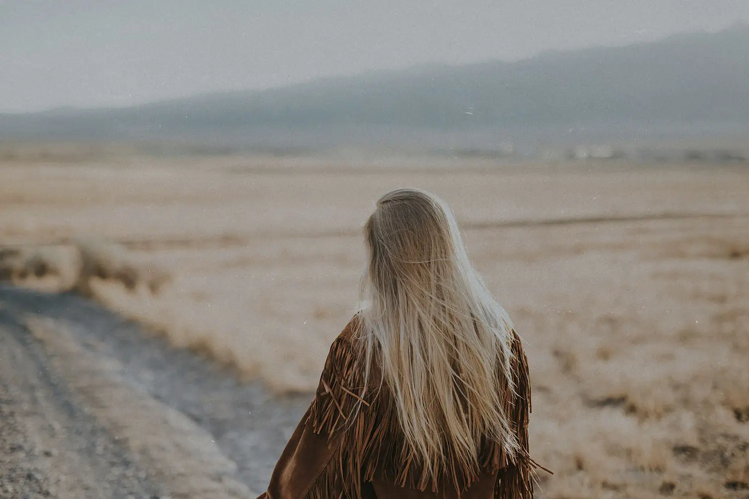person walking a dirt path