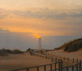 lighthouse at the end of a boardwalk