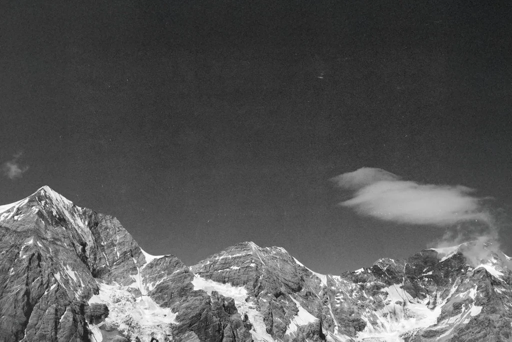 Black and white image of snowy mountain peaks