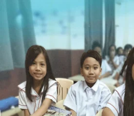 Filipino children in school uniforms smiling
