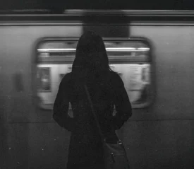 woman standing in subway car