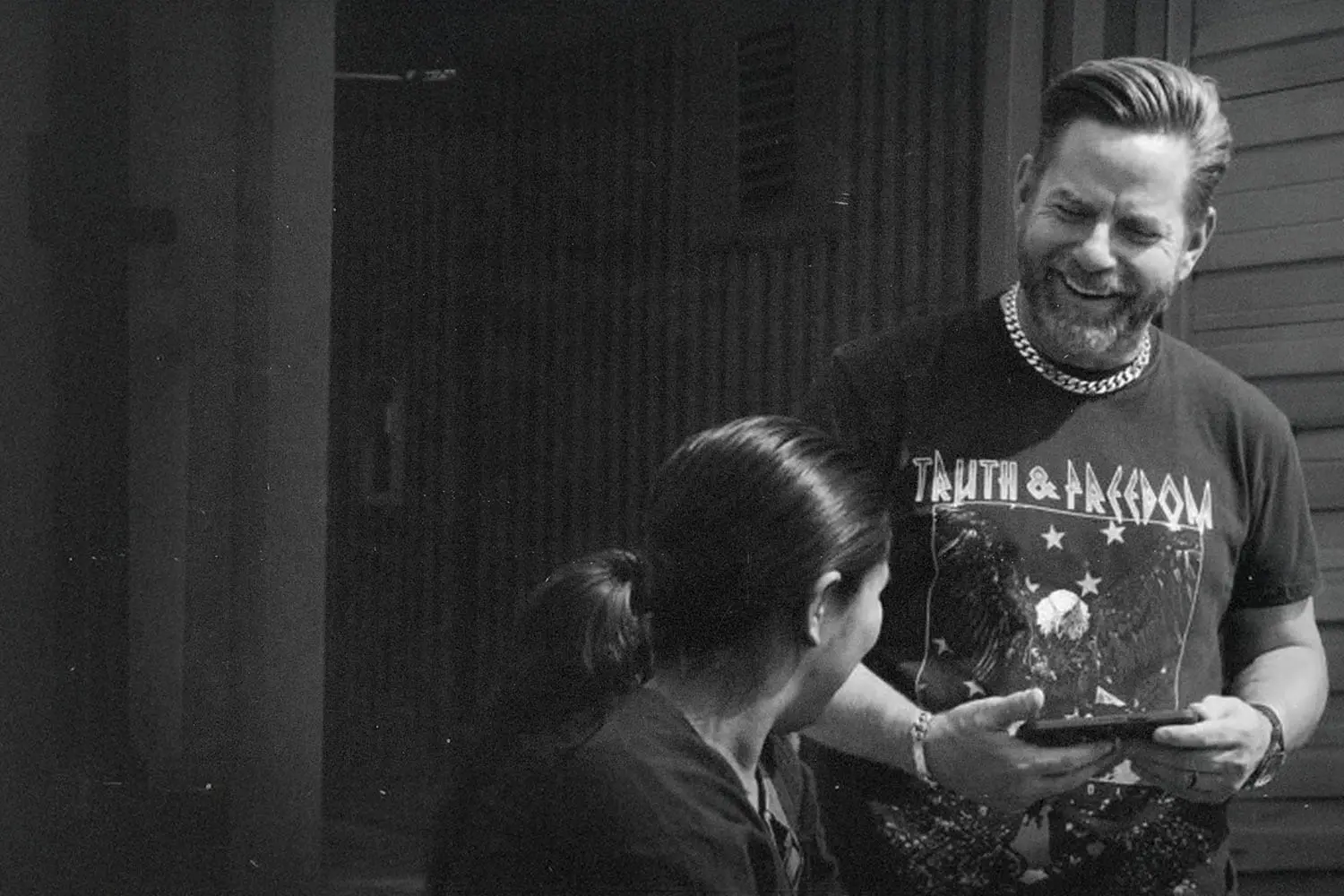 Riley Stephenson smiling and evangelizing to a woman