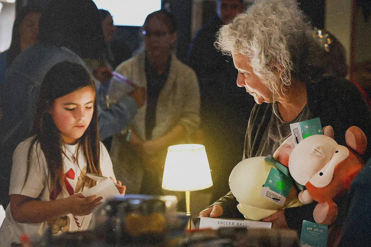 Volunteers helping sort through donated toys at the outreach for Christmas in Kerrville, Texas.