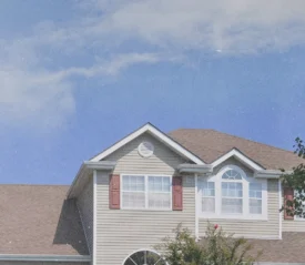 A two-story home looking to the sky