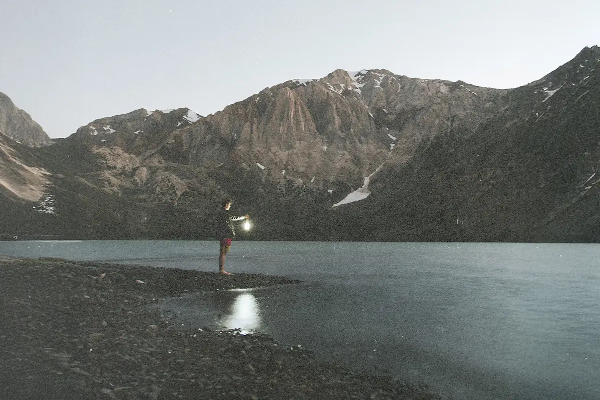 Explore how a Spirit Guide leads believers under the Holy Spirit and God’s Authority, symbolized by a serene mountain lake and quiet reflection.