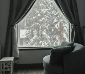 Looking out a snowy window from the living room, representing God who cares about His people.