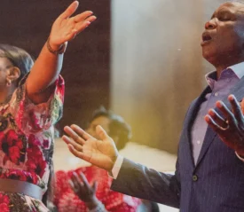 Edgar and Elsie Neluvhalani worshipping in their church in South Africa.